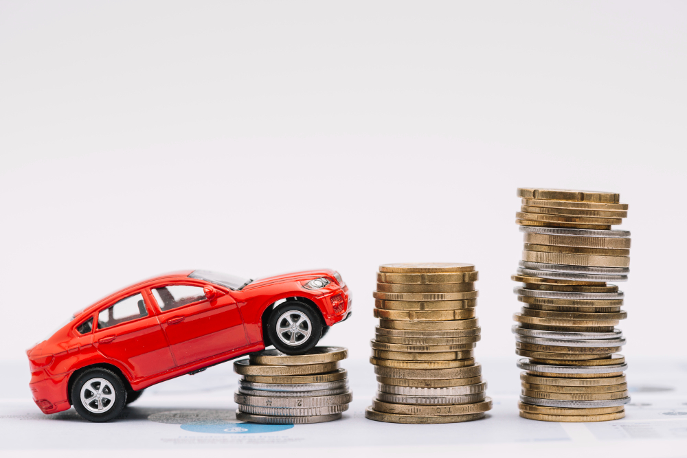 toy car going up increasing stack coins against white background